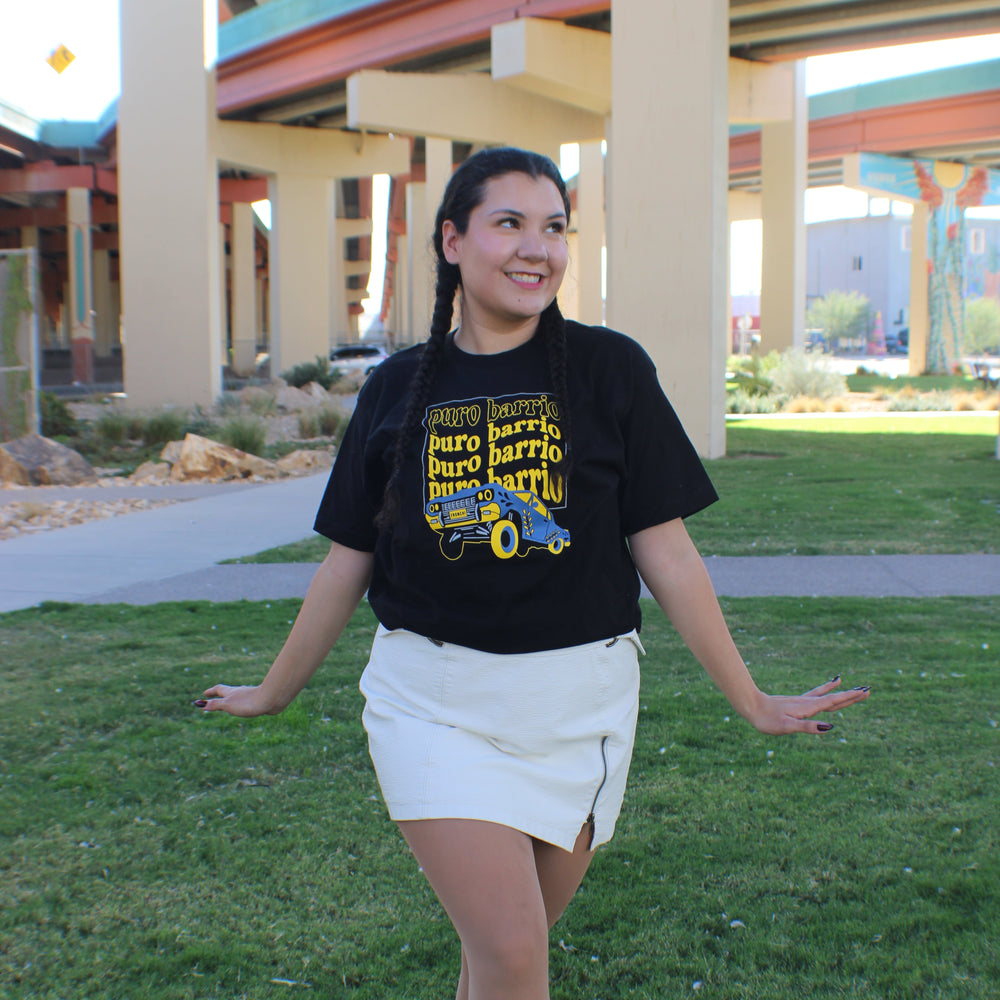 Girl posing with a skirt and black tee
